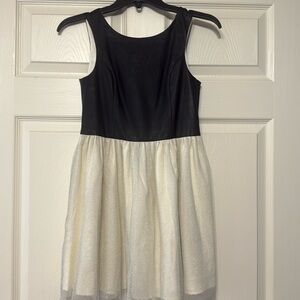 Black leather and cream dress for girl size 10 I purchased it but never worn